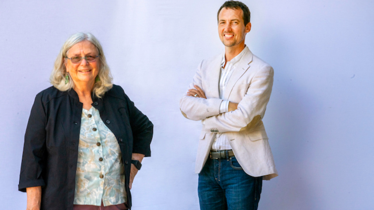 former director Ben Houlton stands with incoming interim director Susan Ustin. 