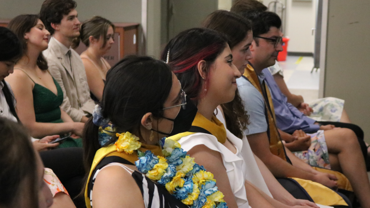 Attendees listen to speakers at an EPM graduation ceremony.