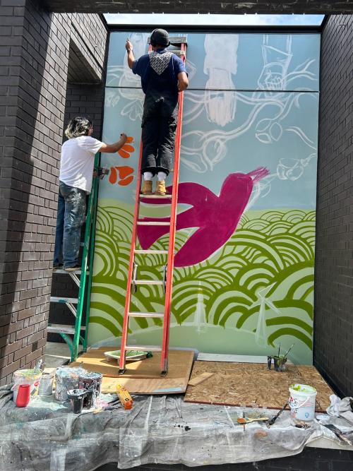 Students painting a mural