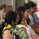 Attendees listen to speakers at an EPM graduation ceremony.