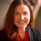 Katharine Hayhoe smiles at the camera. 