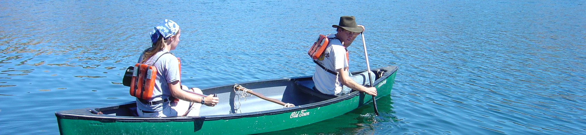 two researchers on the water in a canoe